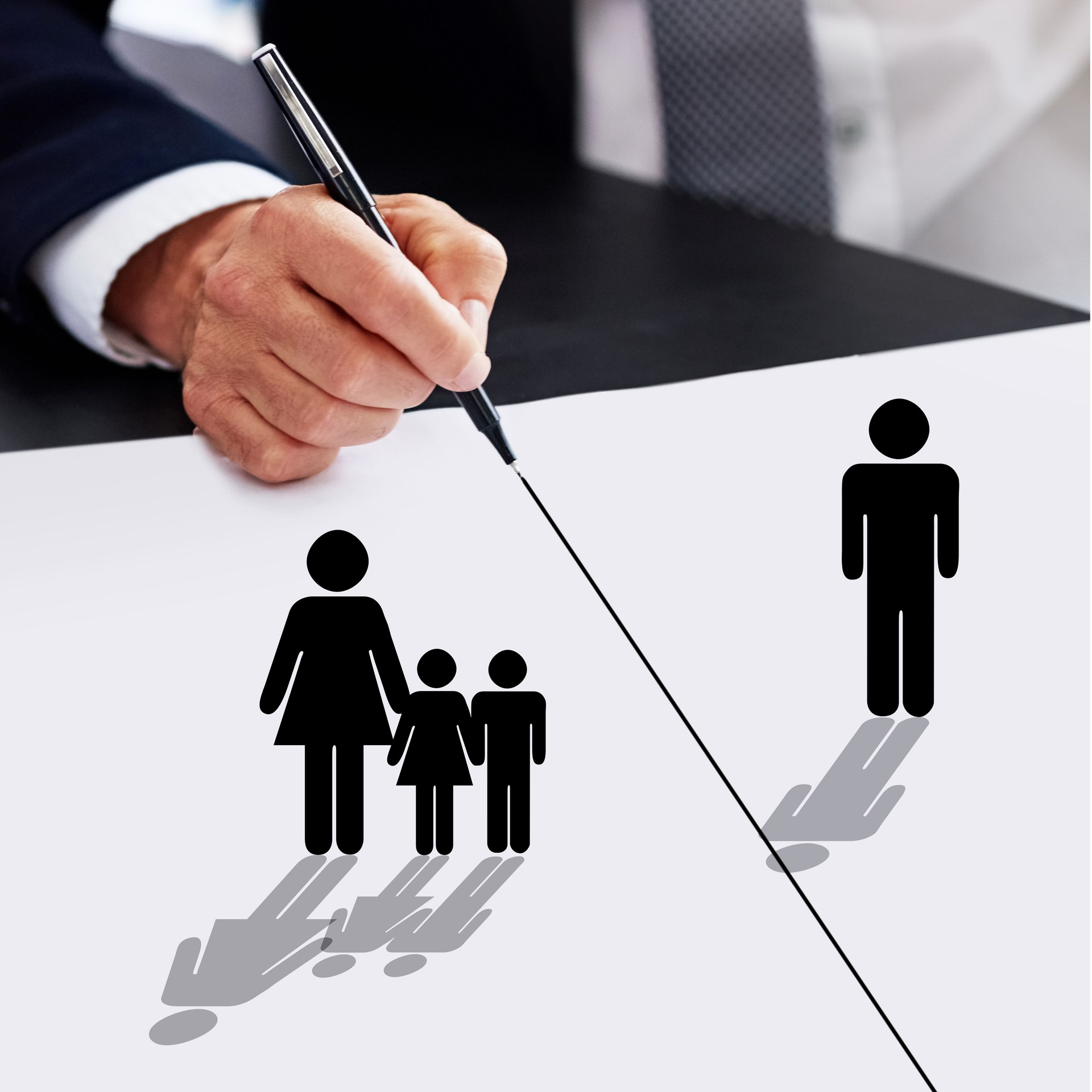 Cropped shot of a businessman drawing a dividing line between a father, his children and their mother
